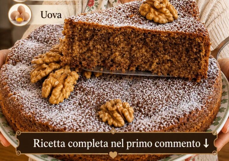 Torta alle noci soffice con superficie spolverizzata di zucchero a velo
